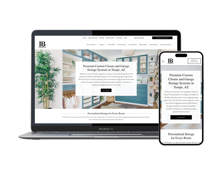 A laptop and a cell phone are sitting next to each other on a white background.