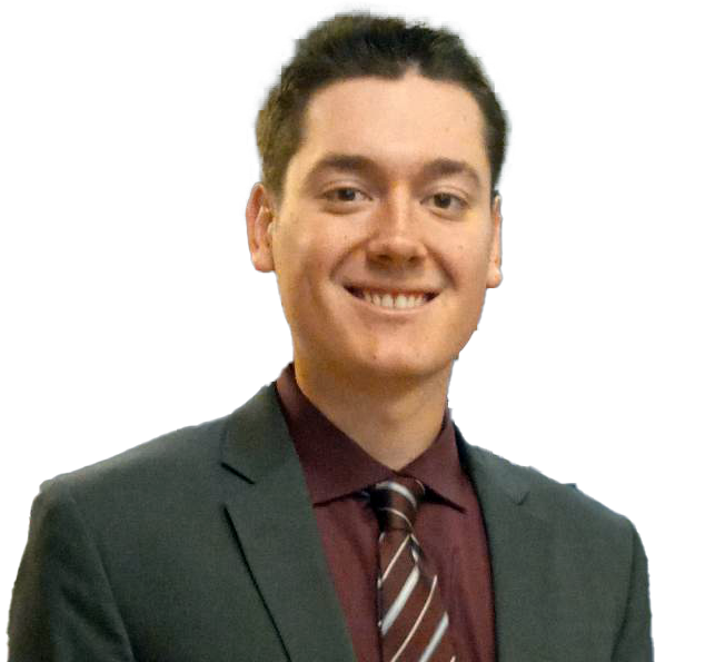 A man in a suit and tie is smiling for the camera