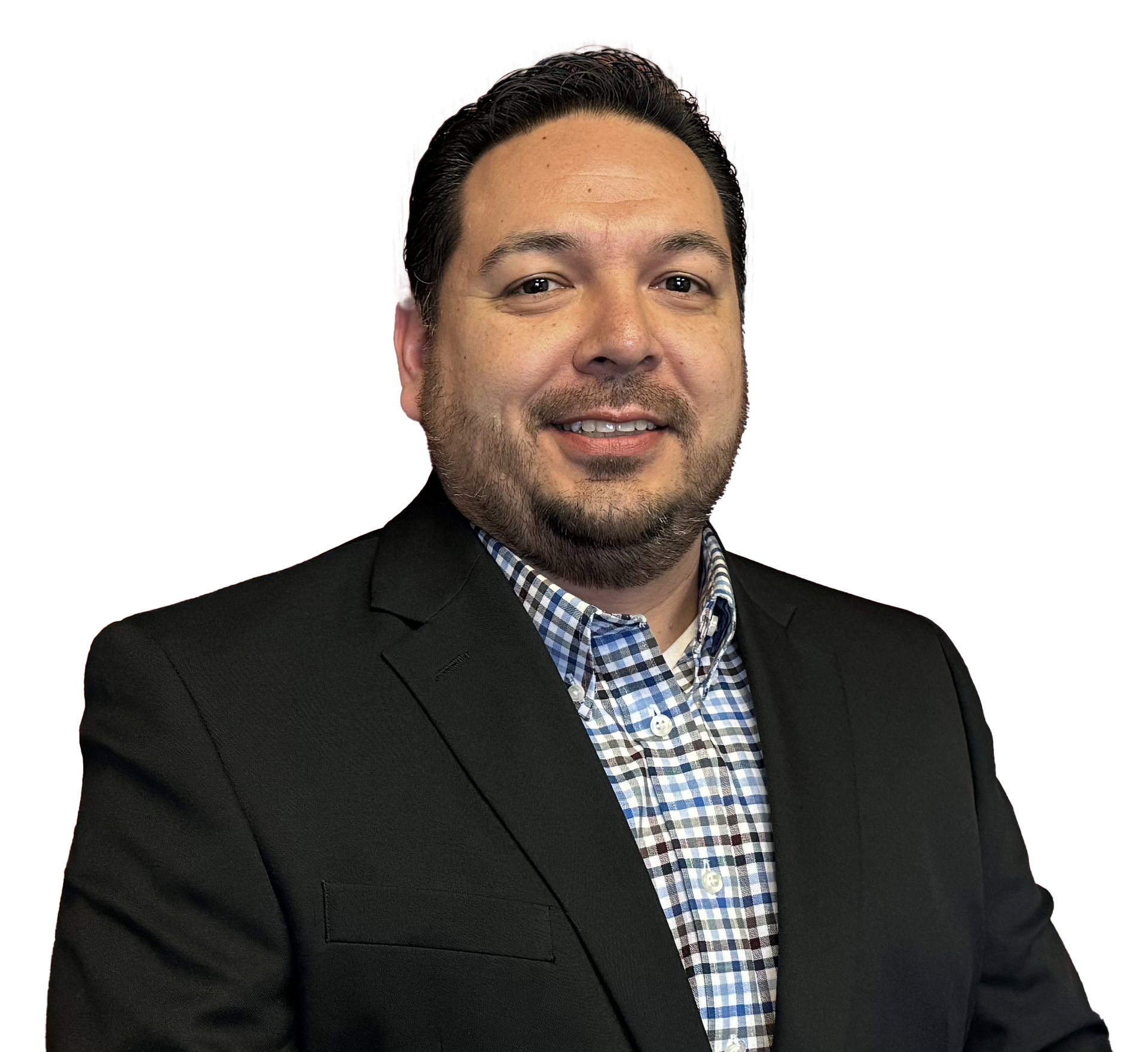 A man in a suit and plaid shirt smiles for the camera