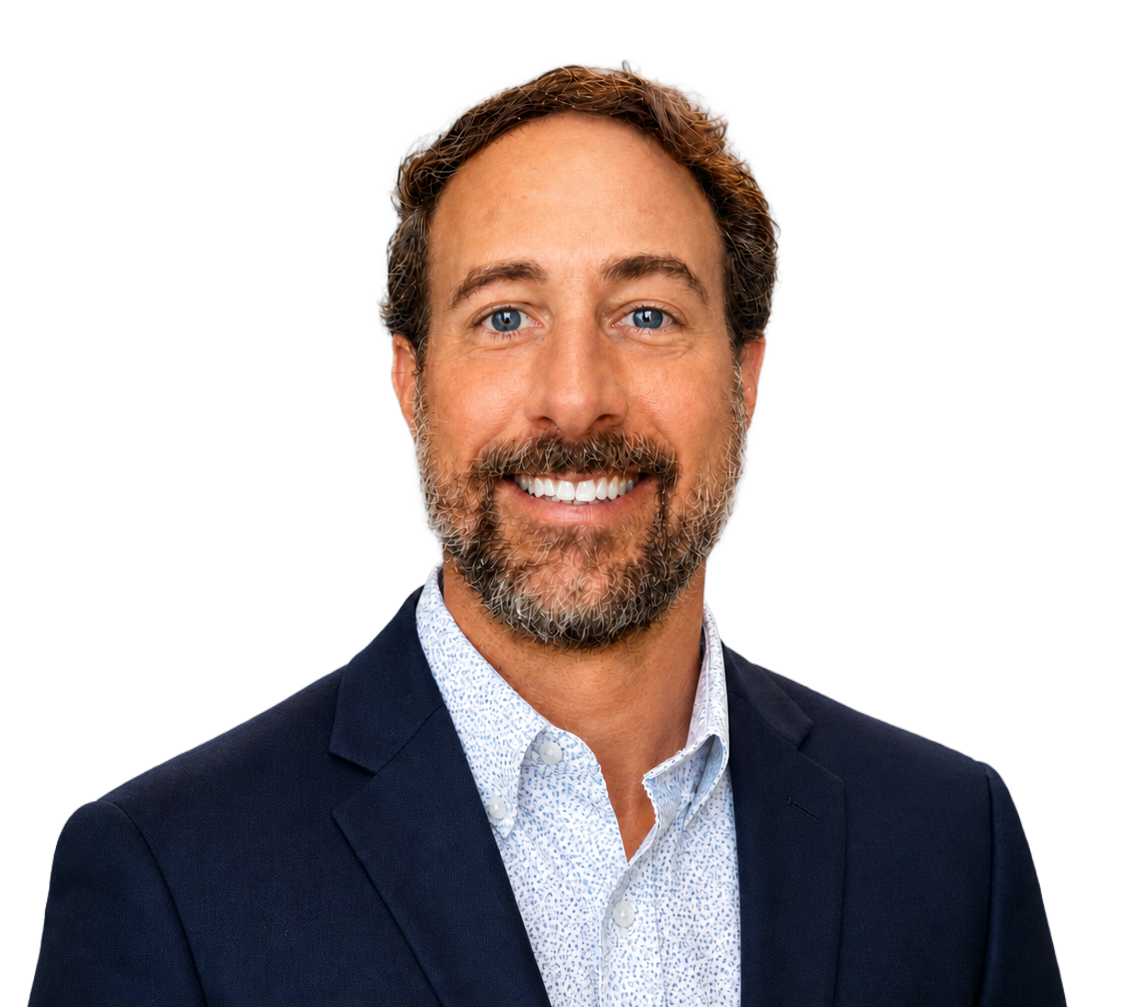 A man with a beard is wearing a light blue shirt