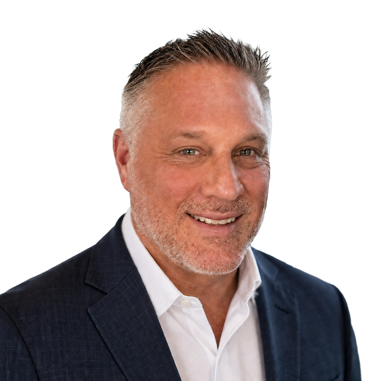 A man in a suit and white shirt is smiling for the camera.