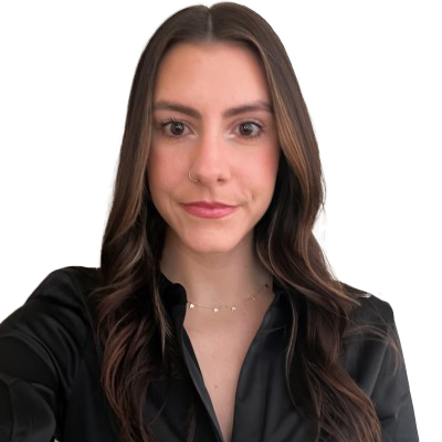 A woman with long hair is smiling for the camera