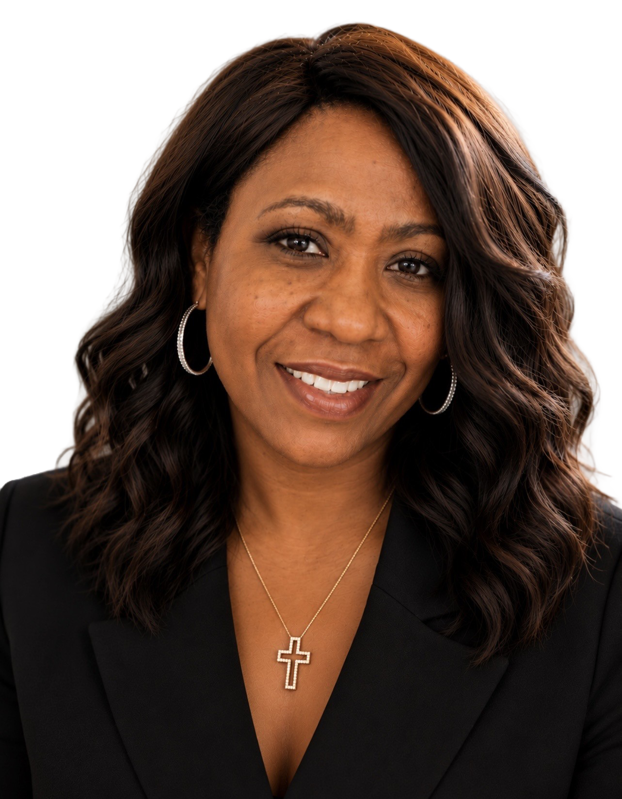 A woman wearing a black jacket and a necklace smiles for the camera