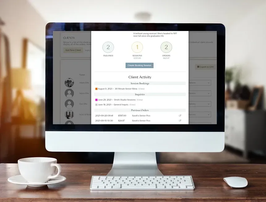 Desktop monitor displaying a progress popup over a user interface, with a keyboard, mouse, and coffee cup on a wooden desk.