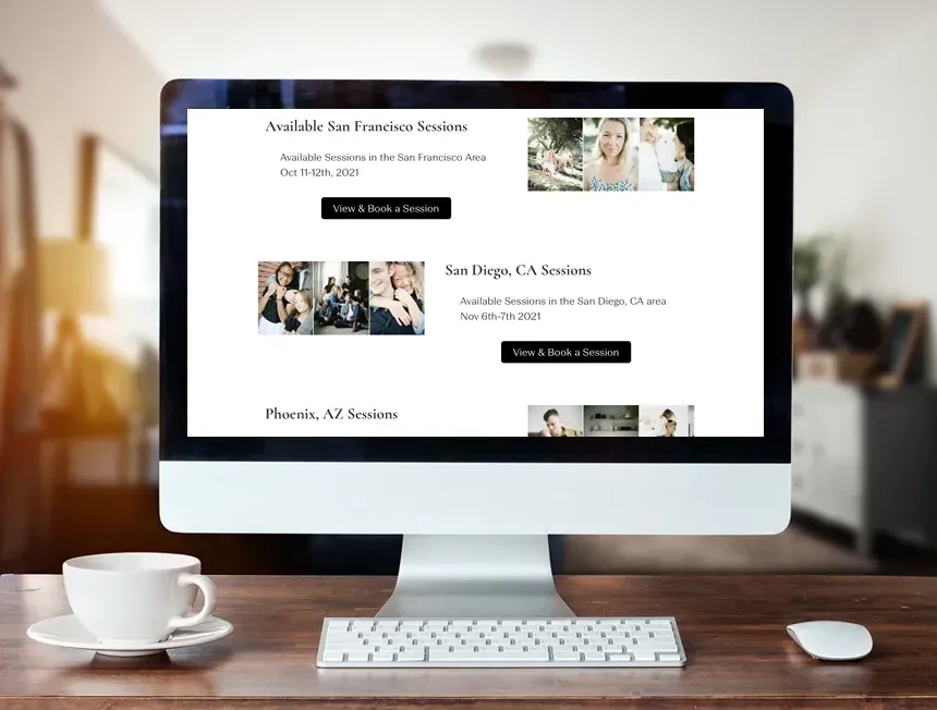 Computer showing website about photo services on a desk with a coffee cup.