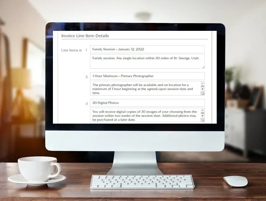 Computer screen showing an online form, with a coffee cup, keyboard, and mouse on a desk.