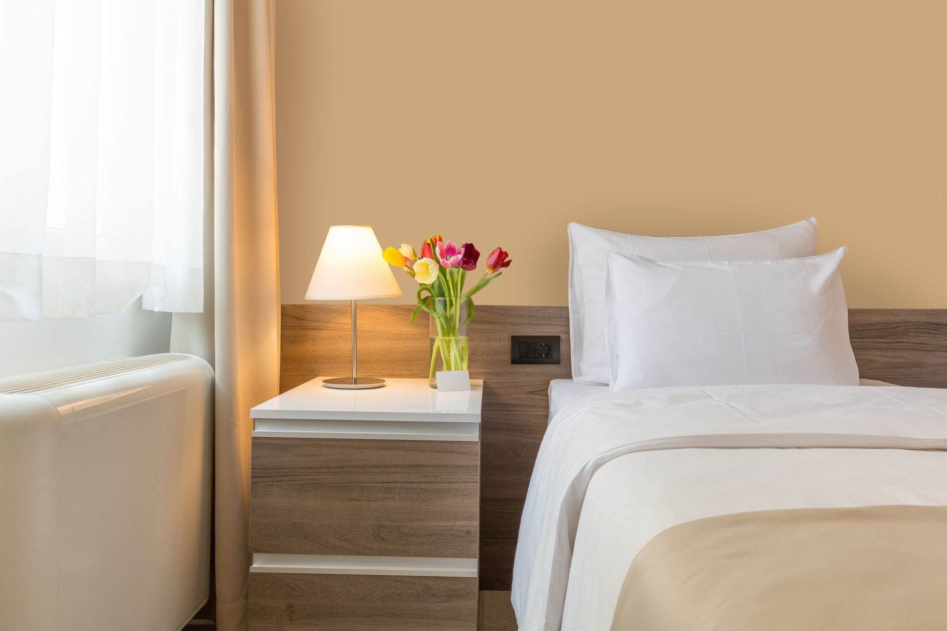 Interior of a Modern Double-Bed Motel Bedroom With Neutral Colours.