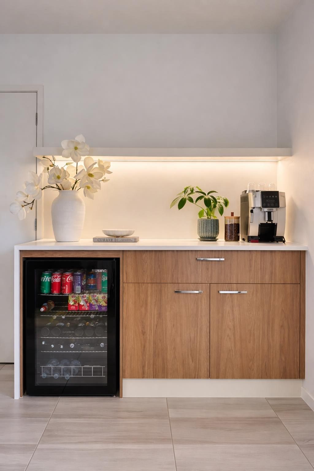 Modern kitchen with wood cabinets, white countertops, and a dishwasher. Island with drawers — Protech Renovations & Joinery in Gregory Hills, NSW