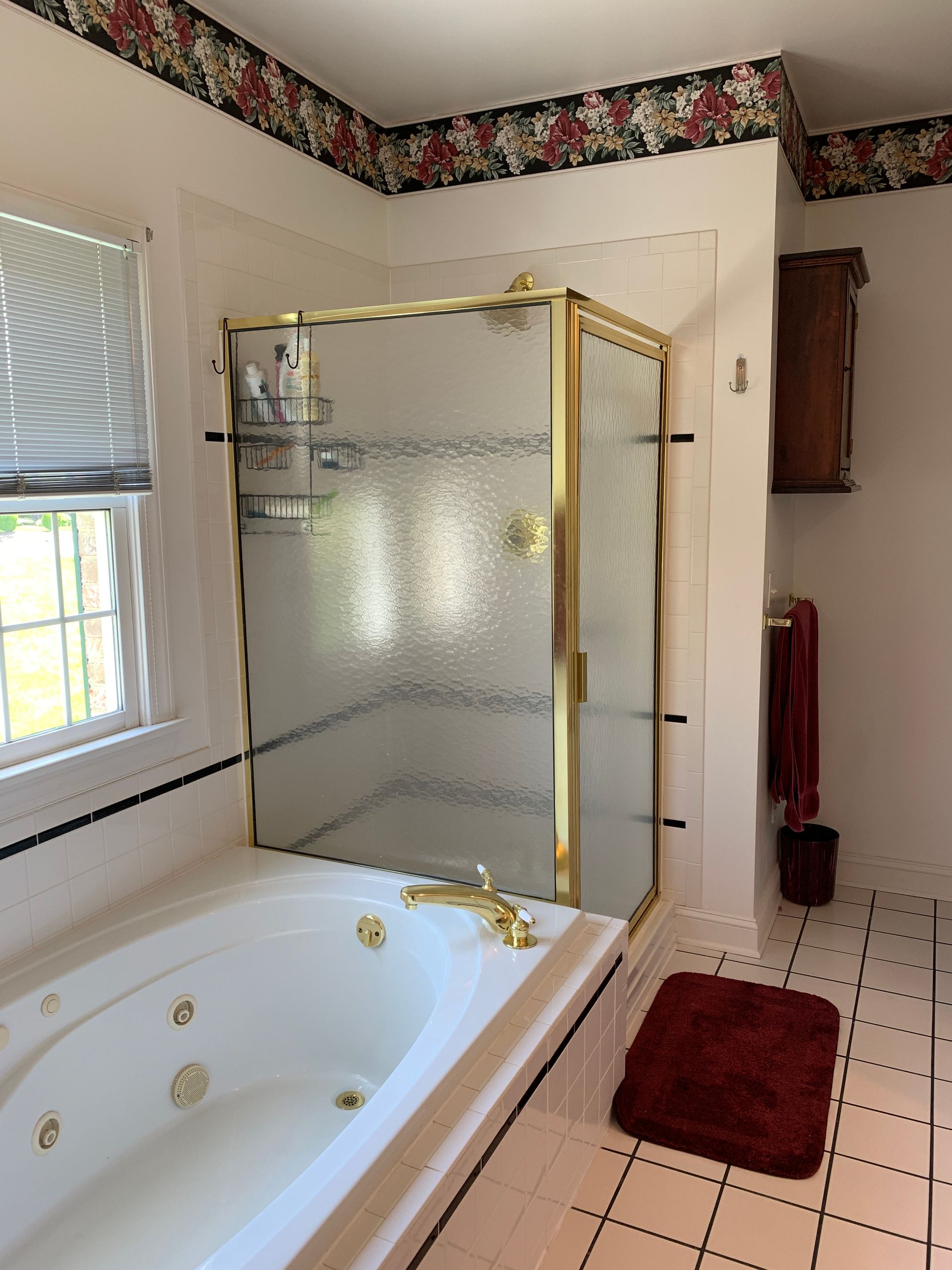 A bathroom with a shower and a bathtub.