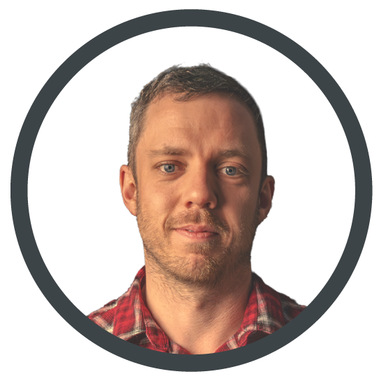 Portrait of a man in a red plaid shirt inside a dark circular frame