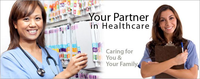 Two healthcare professionals smiling with the words "Your Partner in Healthcare"