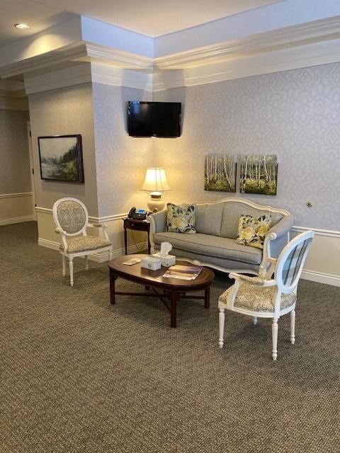 Interior view with couch, two chairs and coffee table at 
K.E. Pike Funeral Home in Cedar Springs, MI 