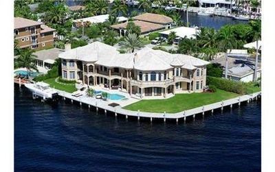 Bring your boat on your own intercoastal dockAn aerial view of a residential area with a sunset in the background.