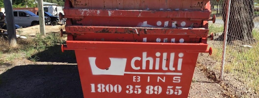 Four Red Skip Bins Stacked  — Chilli Bins Skip Bins in Caloundra, QLD