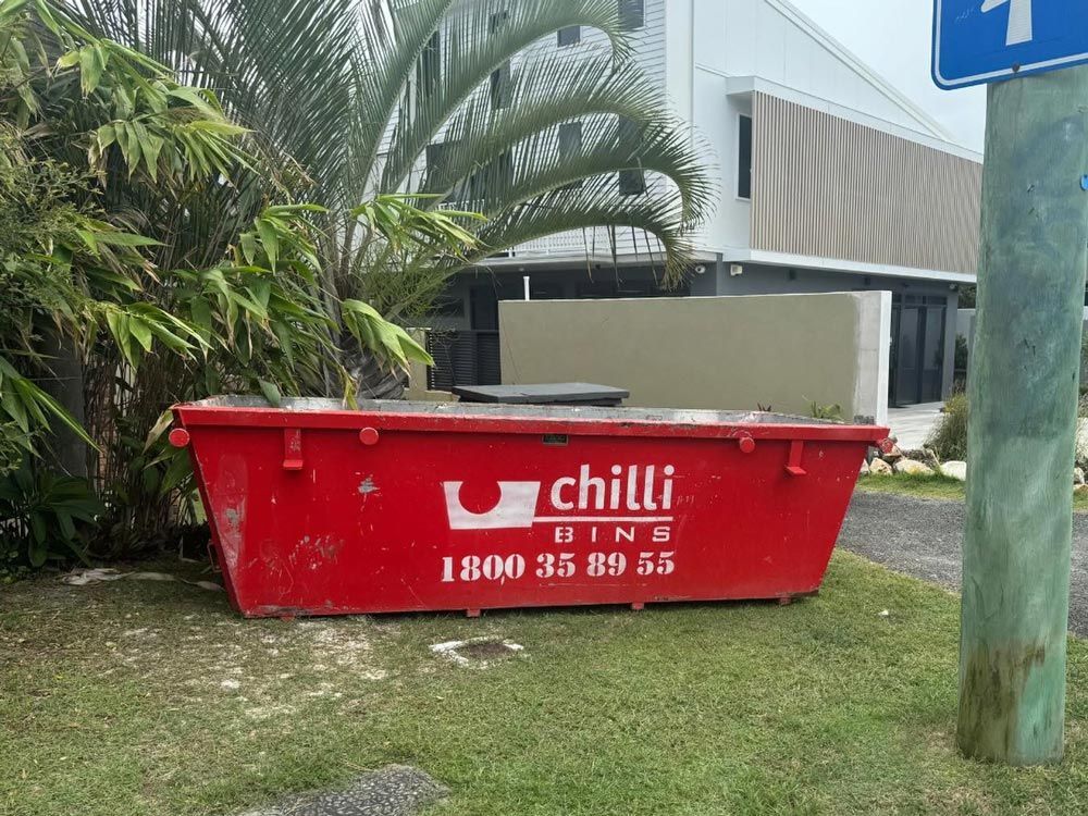 Large Red Skip Bin Outside a Building