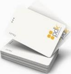 A stack of white business cards sitting on top of each other on a table.