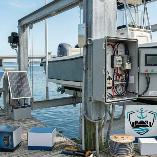 Harbor-side marine monitoring equipment with solar panel, control boxes, and wiring mounted on a dock.
