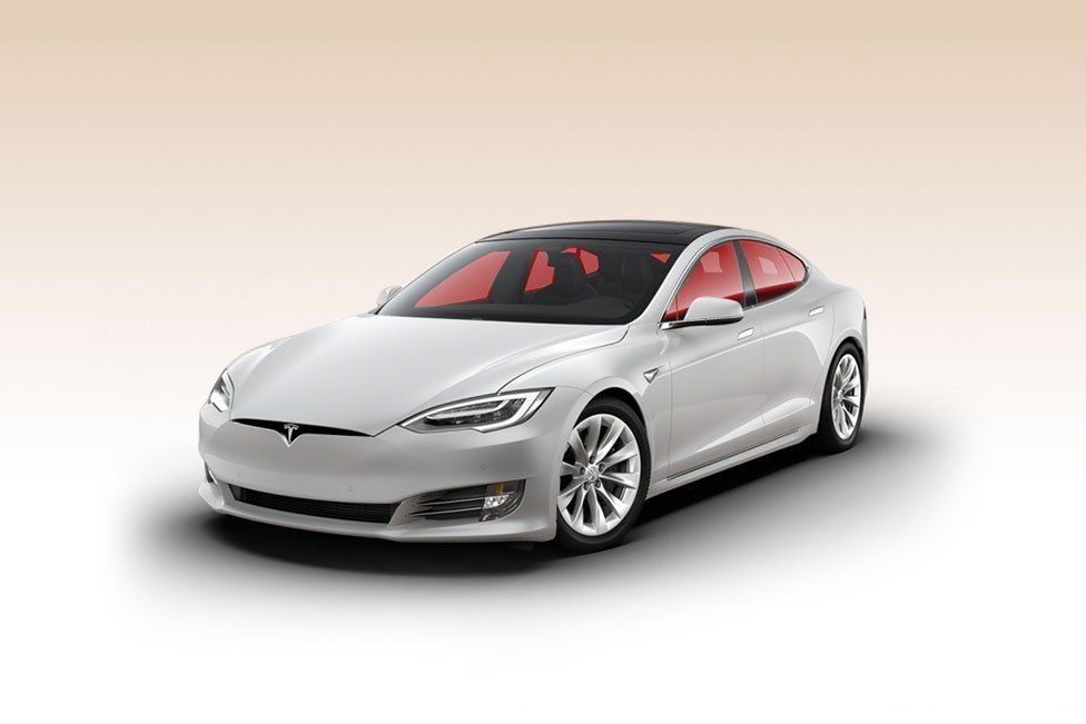 a white tesla model s is shown on a white background .