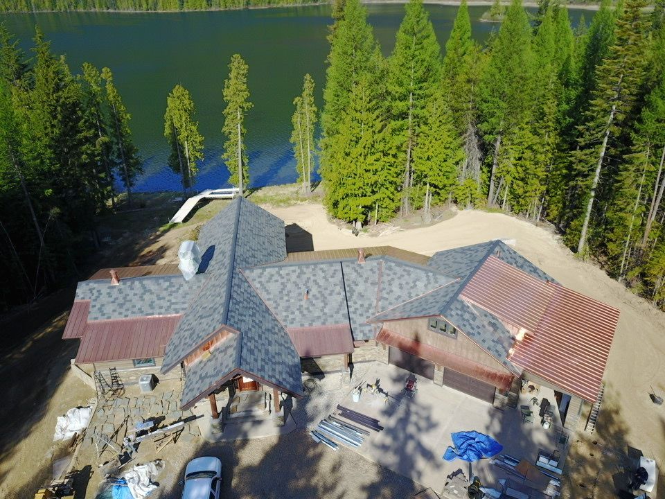 House With Trees & Lake — Billings, MT — Empire Roofing Inc