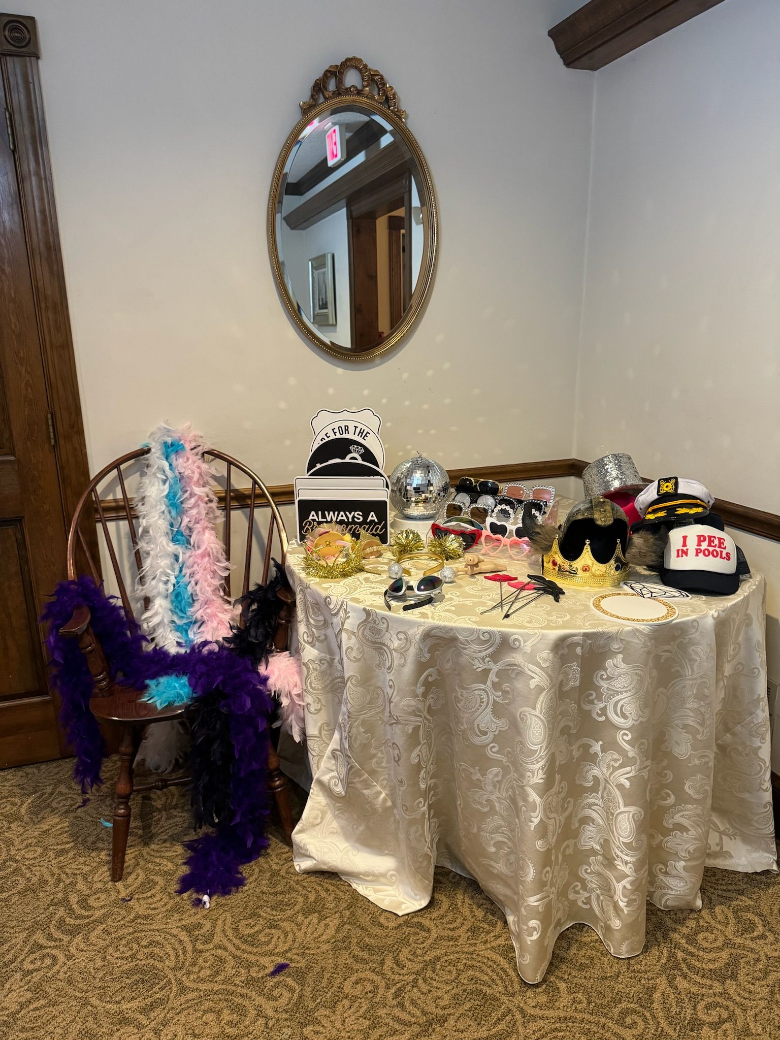 A table with a white table cloth and a variety of photo props.