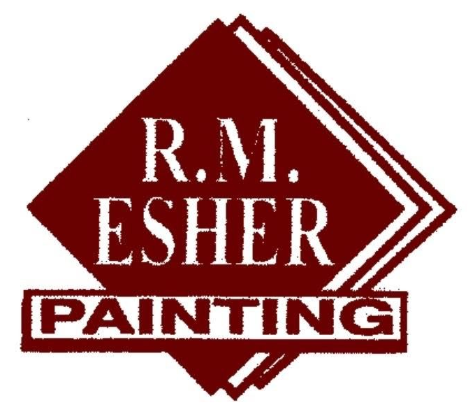 A paint bucket, grey with red paint dripping down the side.