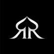 White spade-shaped logo with mirrored “R” letters on a black background