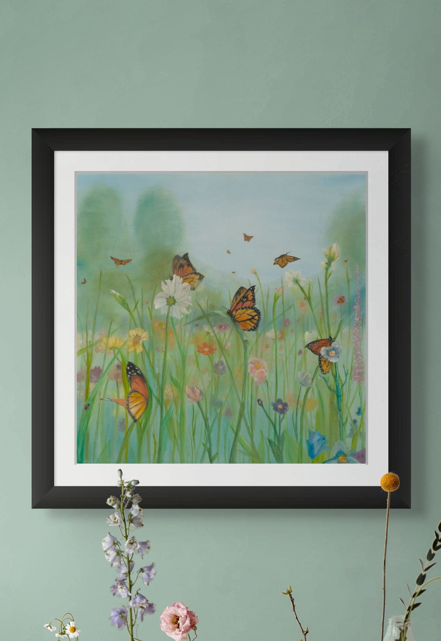 A painting of butterflies flying over a table with vases of flowers is hanging on a wall.