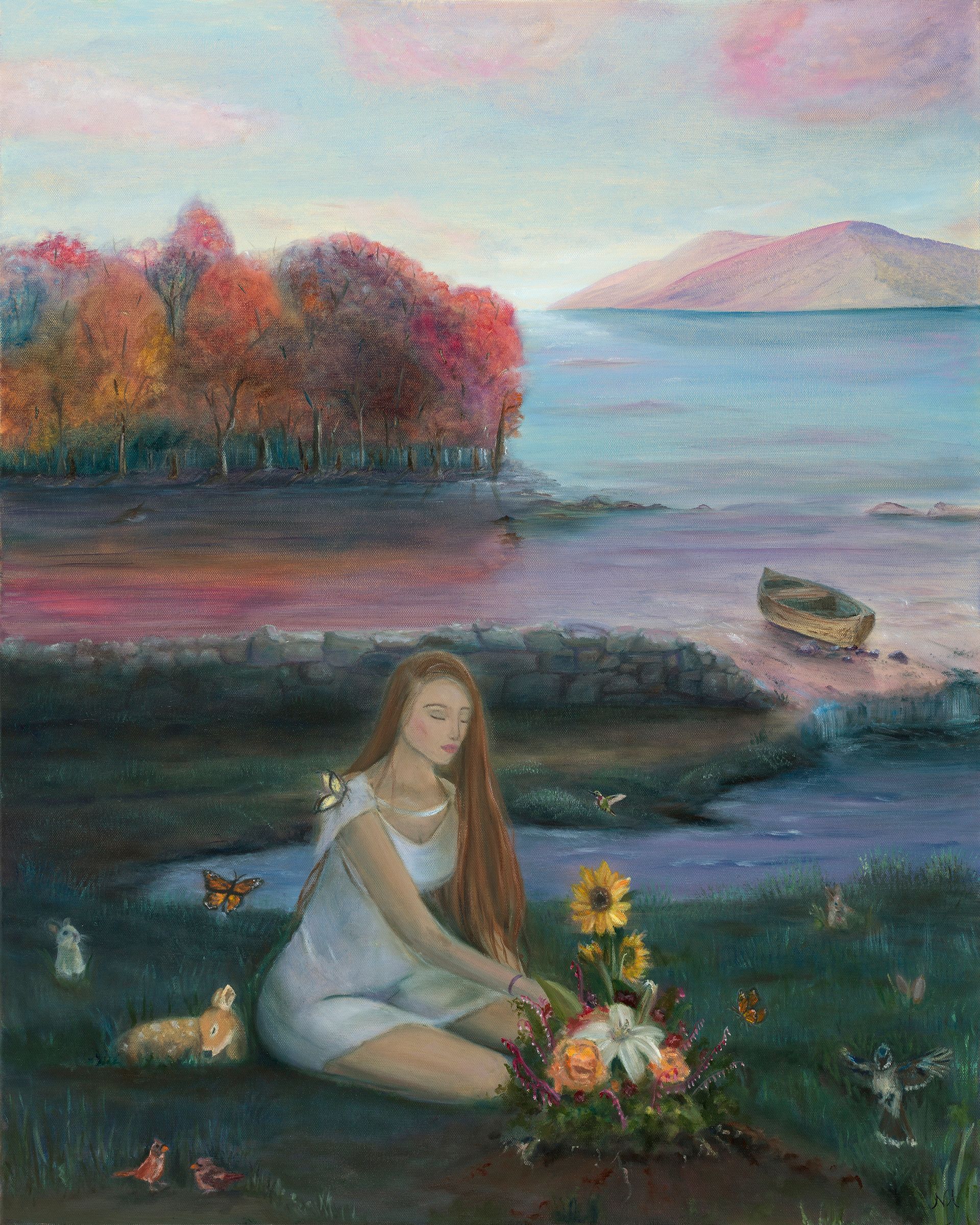 Woman kneeling by flowers, lakeside, adding a bouquet. Fall colors frame the sea and distant mountains.