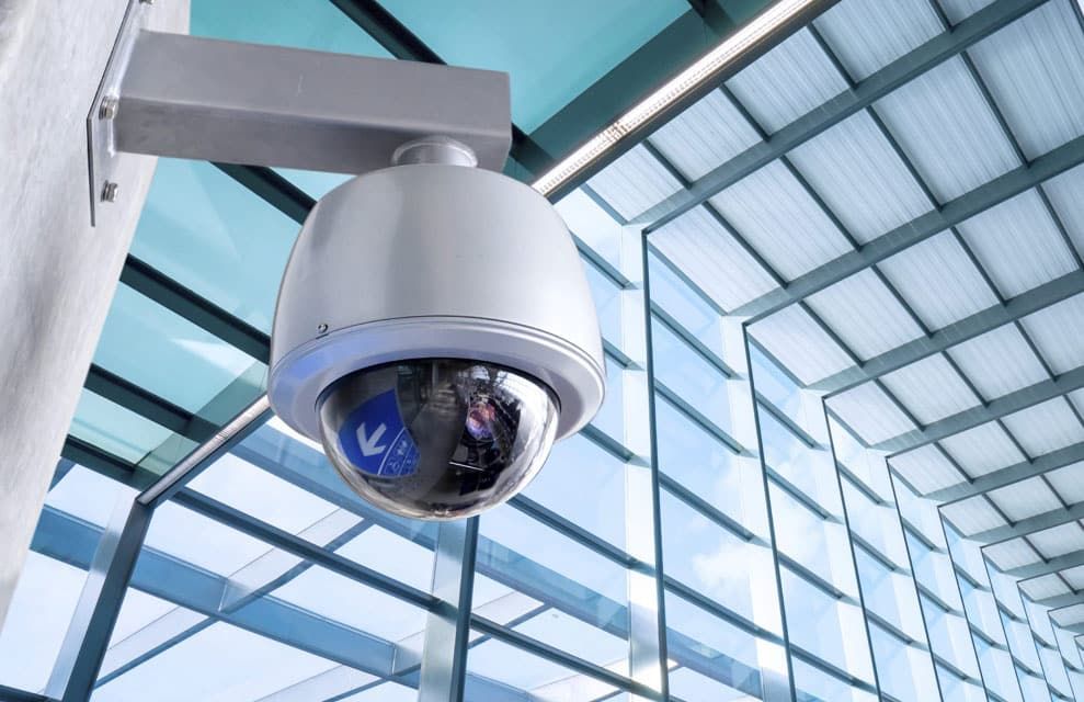 Security Camera Mounted on a Wall, Looking Down at a Glass Ceiling — IRIS CCTV in South Grafton, NSW
