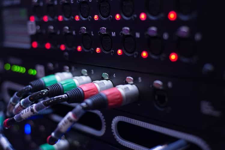 Close-up of a Black Audio Rack With Multi-colored Cables Plugged in — IRIS CCTV in Lismore, NSW