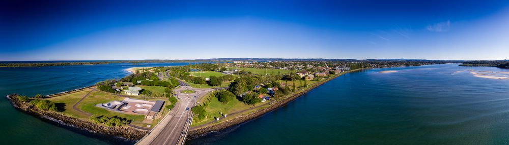 Aerial View of Ballina With Buildings and a Bridge Surrounded by Blue Water Under a Clear Sky — IRIS CCTV in Ballina, NSW