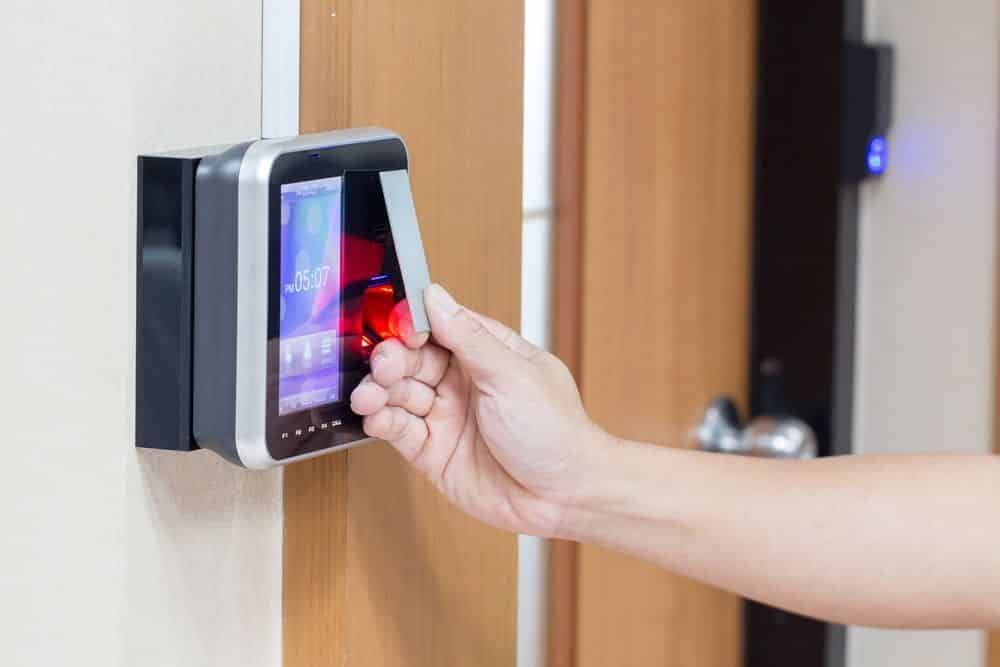 Hand Using a Card Reader to Unlock a Door in an Office Setting — IRIS CCTV in Grafton, NSW