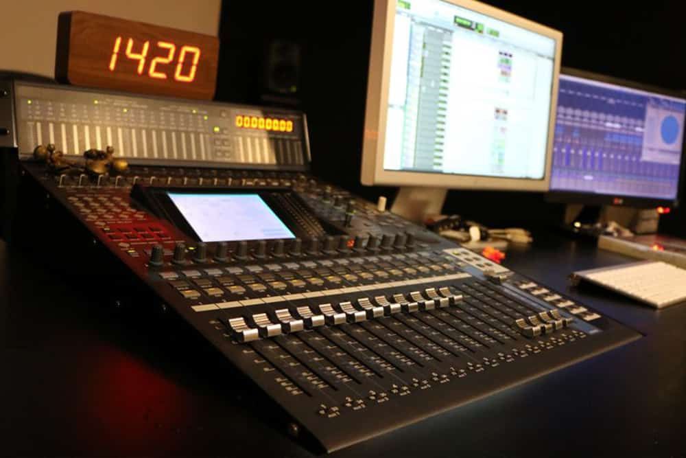 A Black Mixing Console in a Recording Studio With Two Computer Monitors Displaying Audio Editing Software — IRIS CCTV in South Grafton, NSW