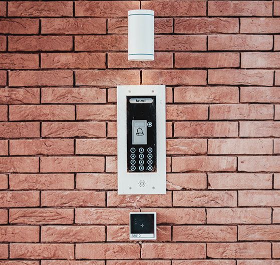 Intercom System on a Brick Wall With a Panel With Keypad, Speaker, and Camera, Connected to a Top Sensor and Bottom Control Panel — IRIS CCTV in South Grafton, NSW