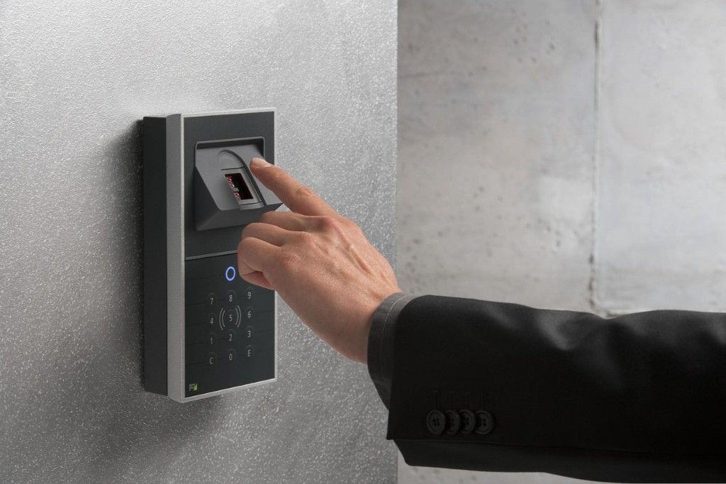 Person Using a Fingerprint Scanner on a Wall to Gain Access — IRIS CCTV in South Grafton, NSW