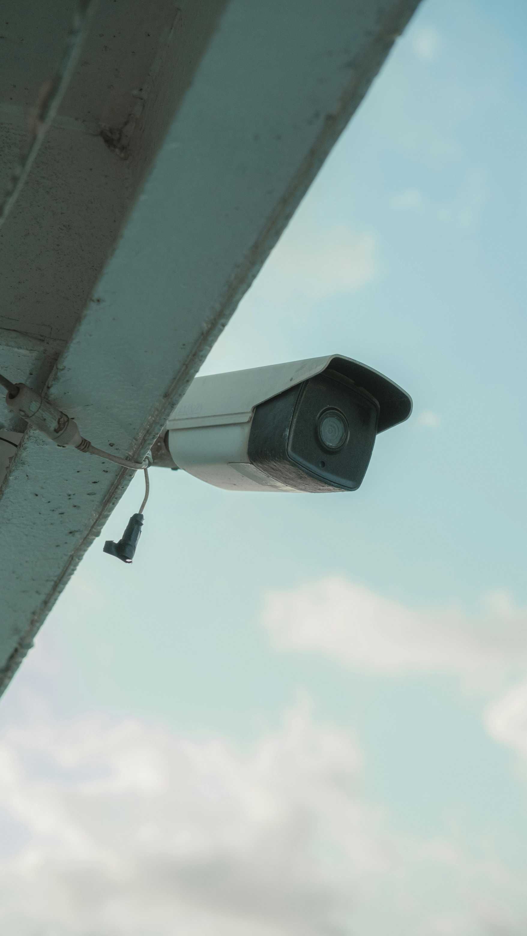 Security Camera Mounted Under a White and Blue-grey Structure — IRIS CCTV in Woolgoolga, NSW