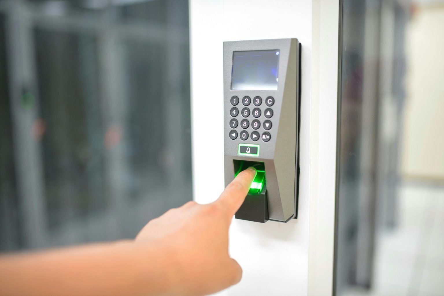 Finger Pressing on Fingerprint Scanner to Access a Secured Area — IRIS CCTV in Lismore, NSW