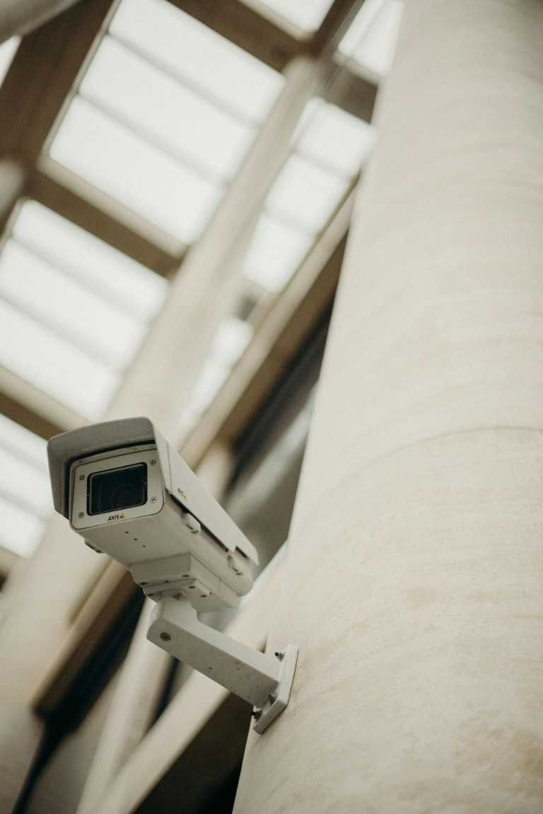 Security Camera Mounted on a White Pillar in a Building — IRIS CCTV in South Grafton, NSW