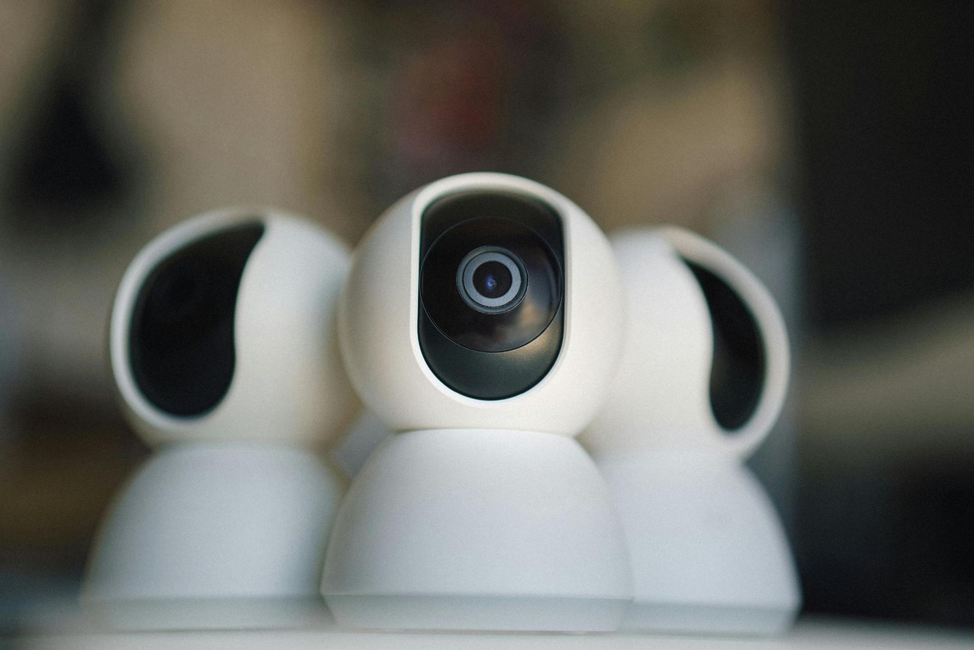 Three White Security Cameras, Lens Forward, Standing Close Together — IRIS CCTV in Glen Innes, NSW