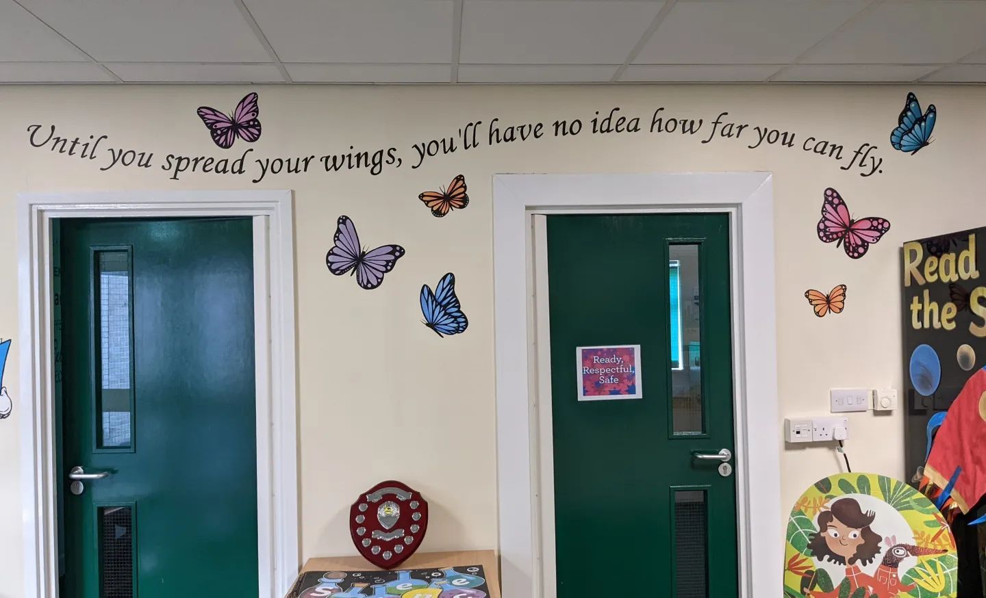 Hand painted primary school murals Stockton Teesside north east England UK butterfly spread wings insirational quote 