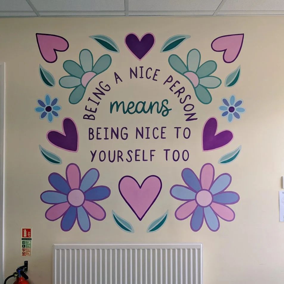 Hand painted primary school murals Stockton Teesside north east England UK staff room inspirational quote Bader 