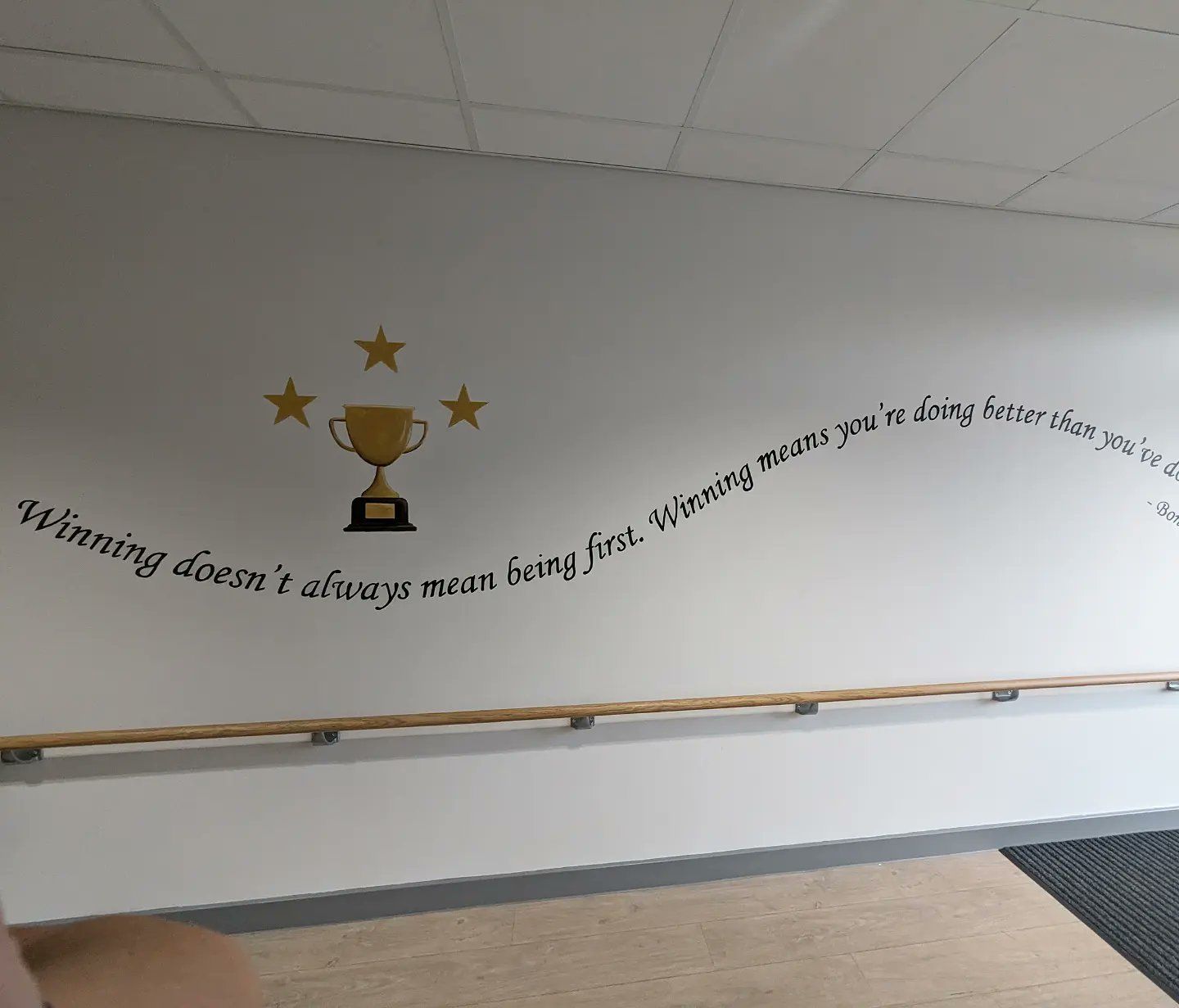 inspirational quote hand painted in discovery special academy mural winning art education