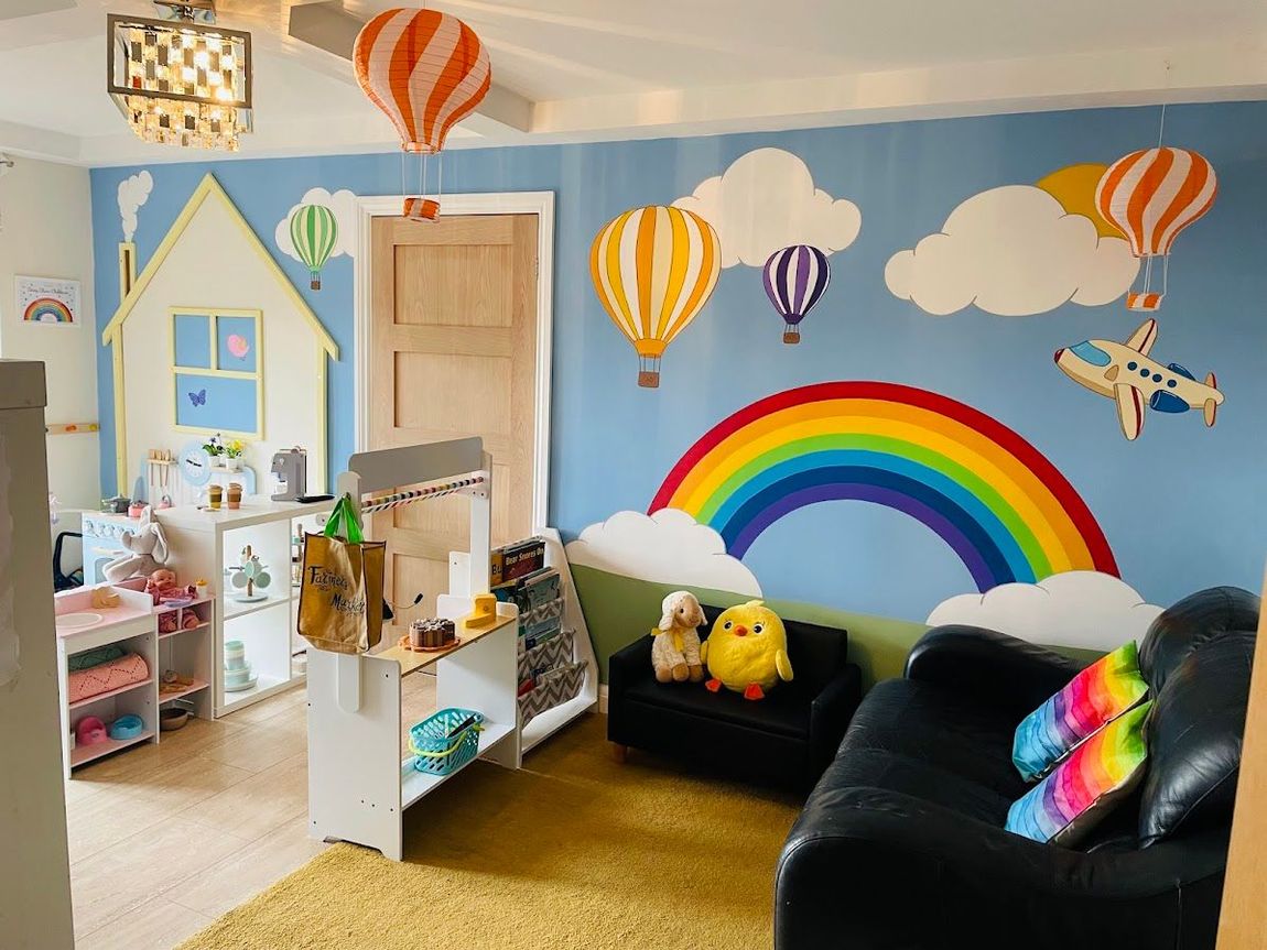 Daisy chain murton playroom fun house play rainbow hot air balloons aeroplane bespoke mural children preschool toddlers 