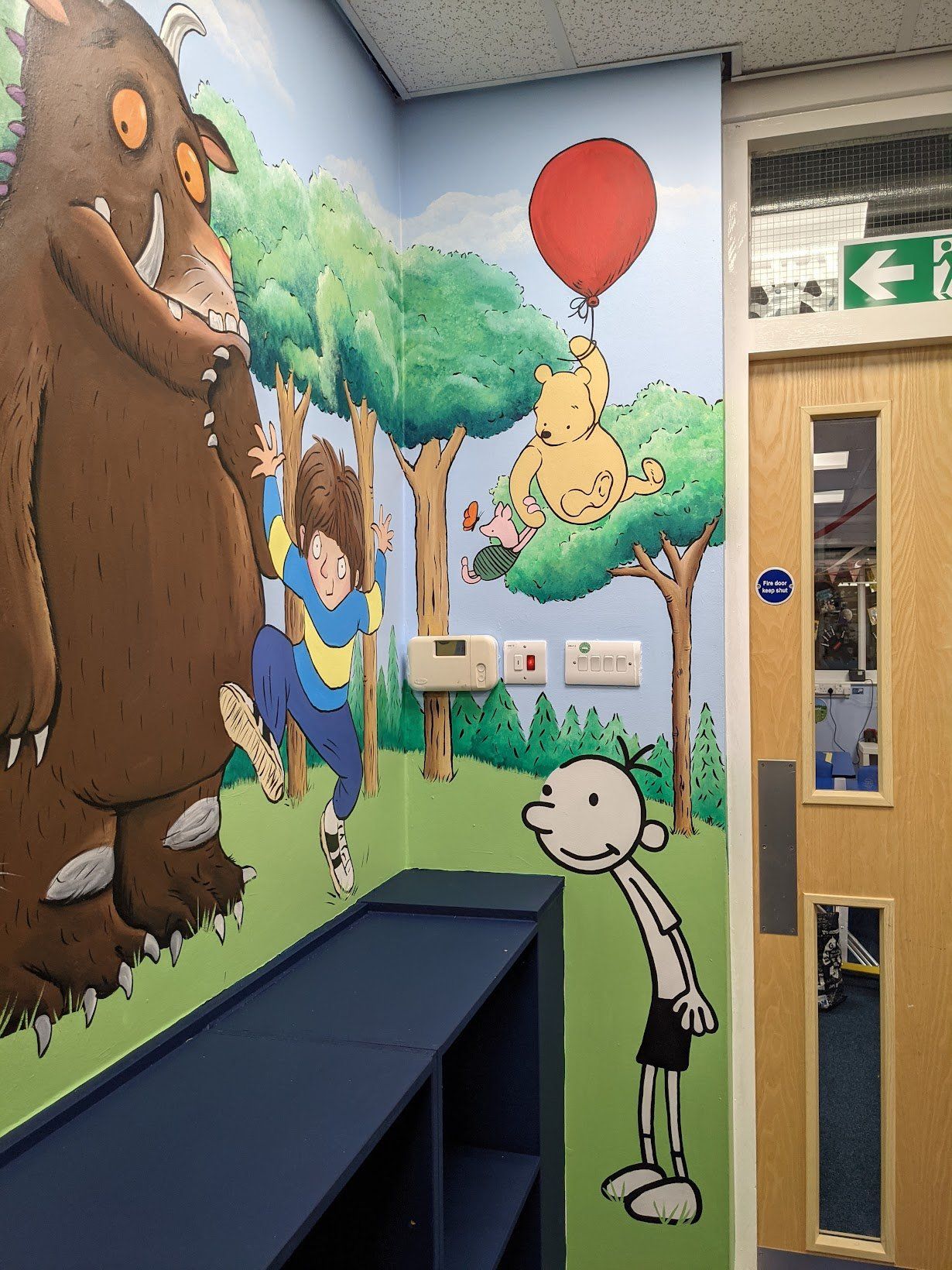 NOPA library murals in a primary school magical enchanted image with popular book characters
