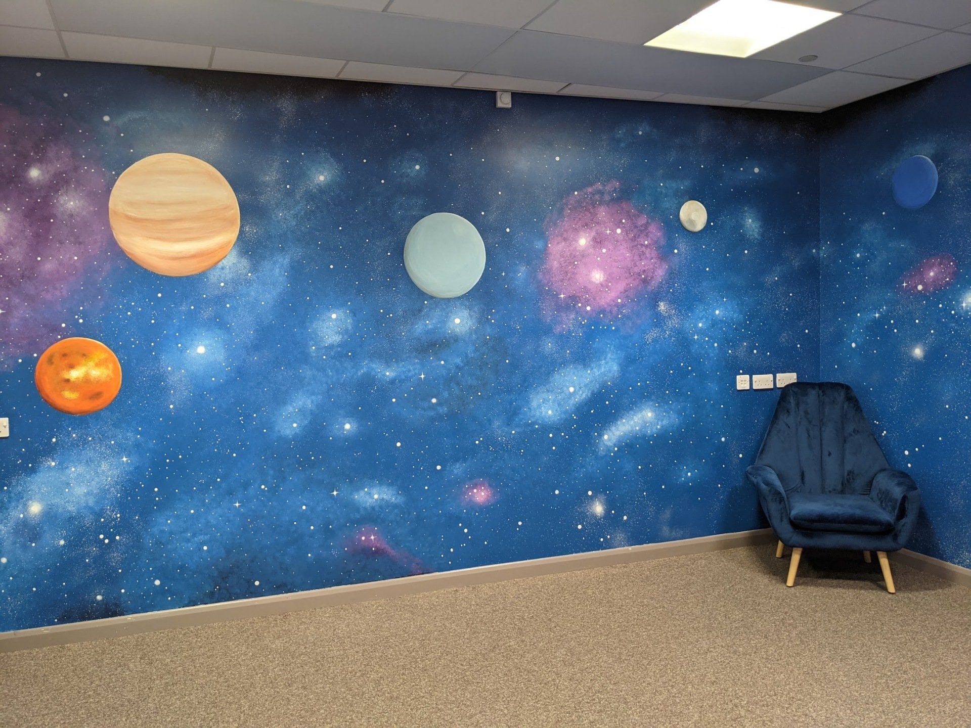 space scene hand painted for a sensory room in a primary school