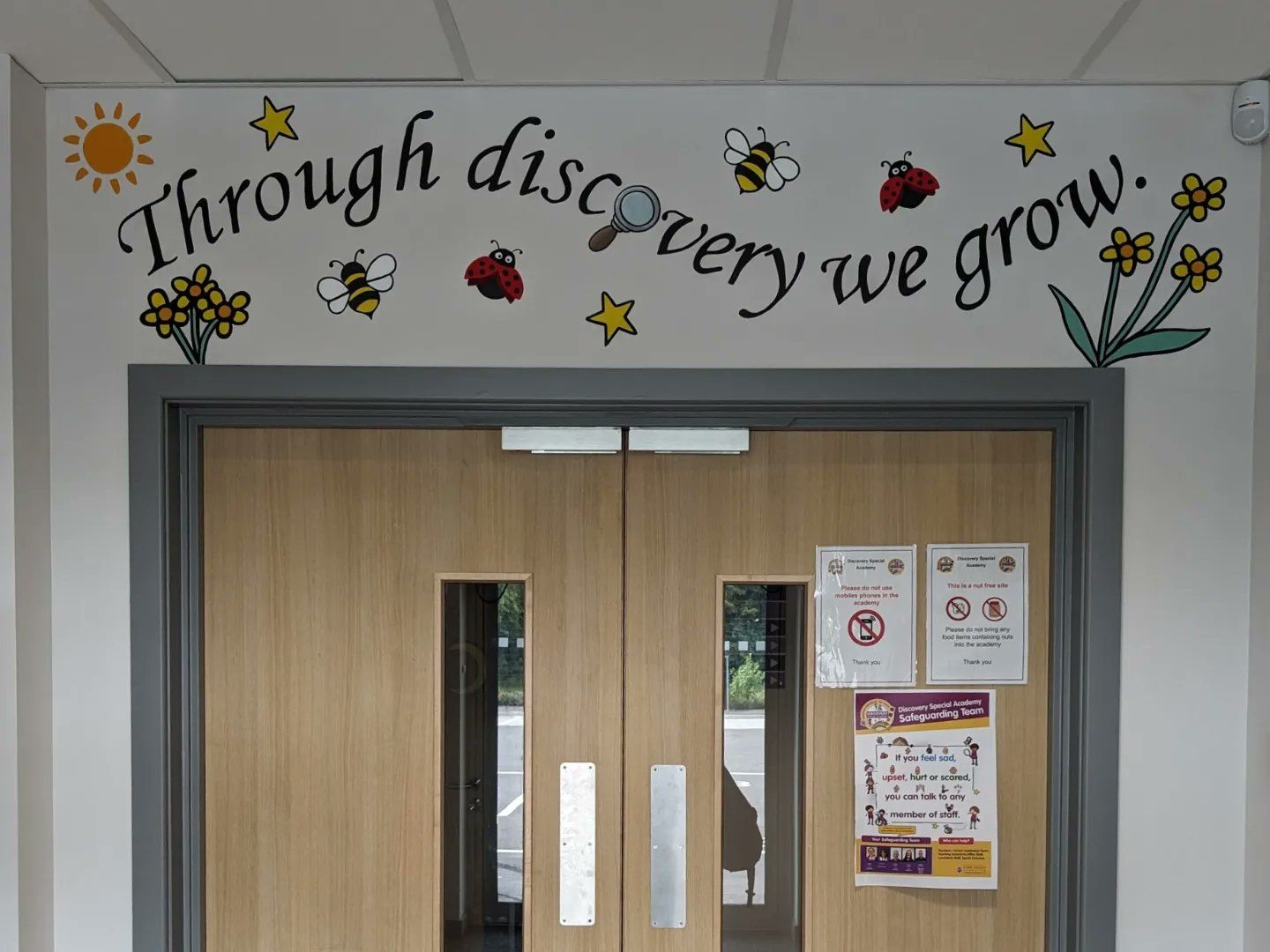 Discovery special academy sign in entrance mural sen education growth 