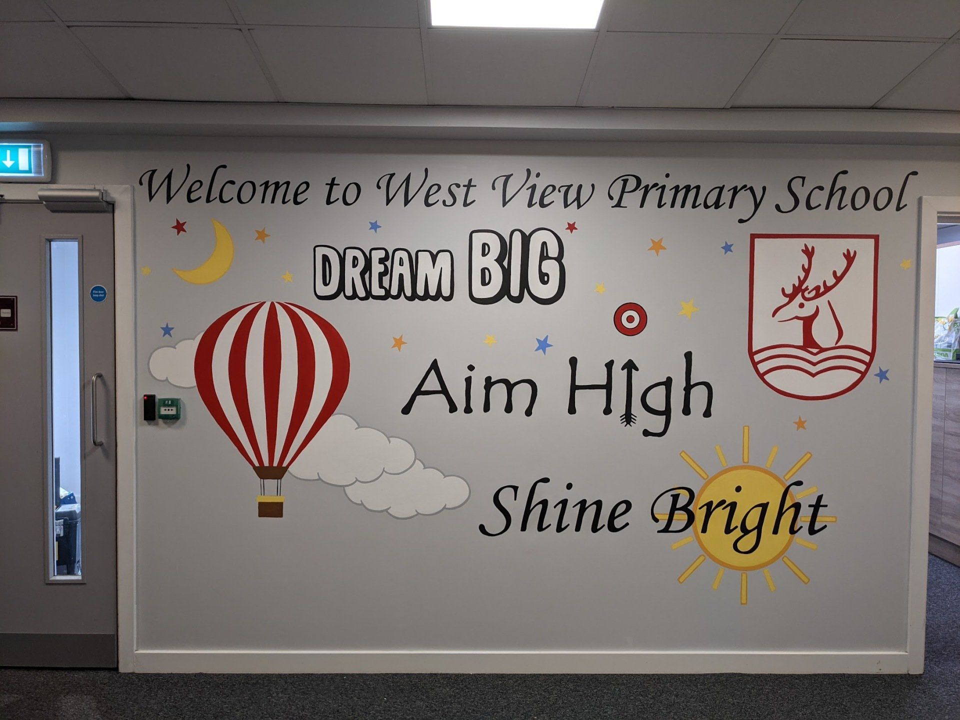 welcome to west view primary school dream big aim high with moon hot air balloon and logo
