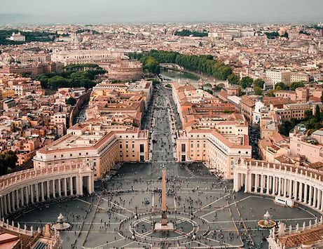 Aerial view of St. Peter’s Square in Vatican City with crowds and surrounding colonnades