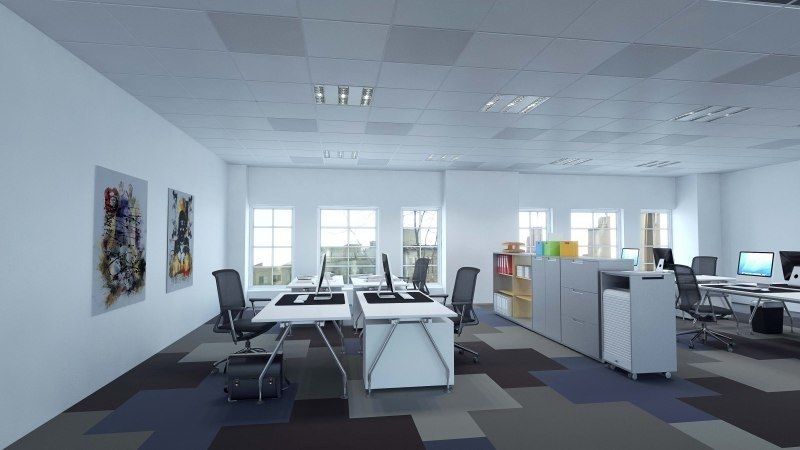 Kantoorruimte met werkplekken en een systeemplafond