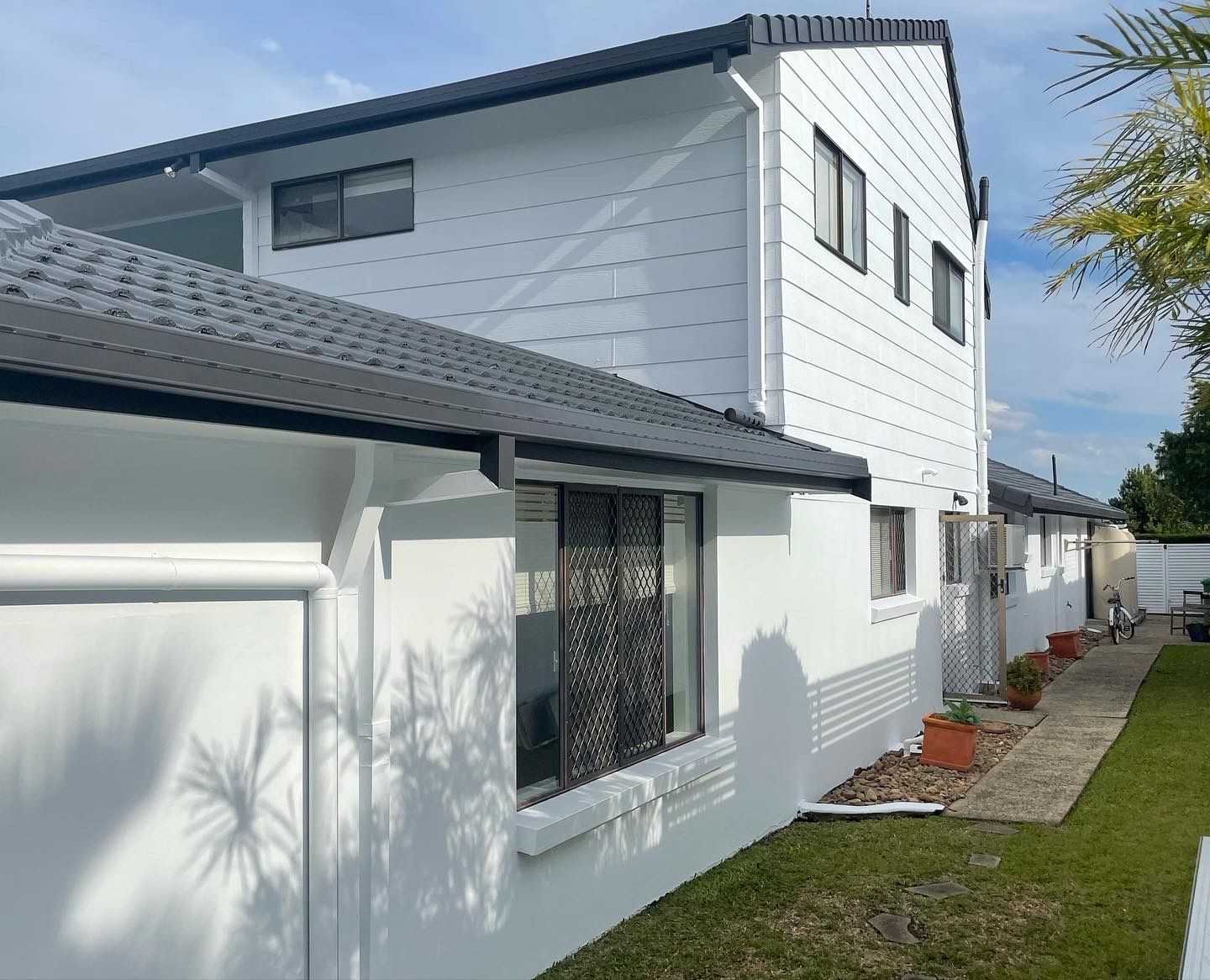 Handyman working on Repairing the roof
 — Roof Restoration in Southport QLD